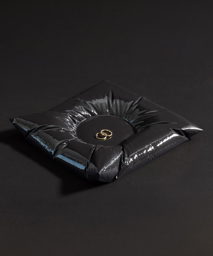 A signature LACKERED catchall made from polymer gypsum. Visually plush, but structured in composition.
