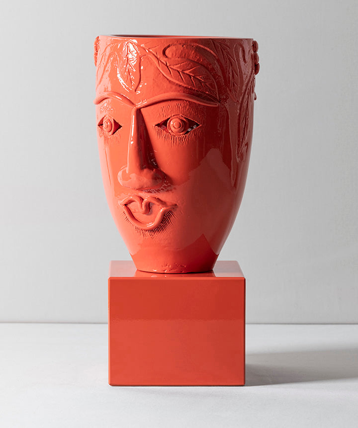 Two Faced | Double faced terracotta vessel sitting on solid marble base.