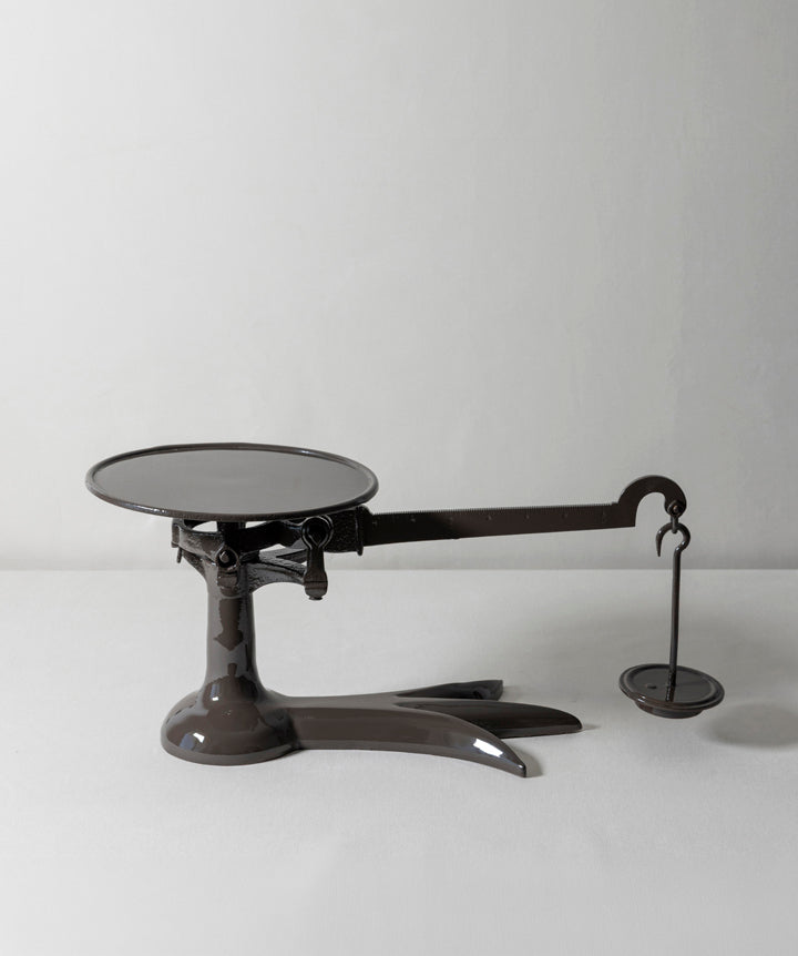 Cast Iron scale. A utilitarian silhouette repurposed into a statement piece that’s playful with a masculine edge.