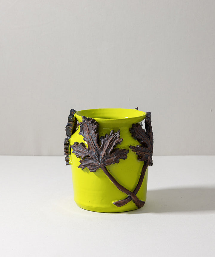 The body of this 1990s vessel was smoothed before being reimagined in a vivid neon finish that allows the metal overlay to really pop.