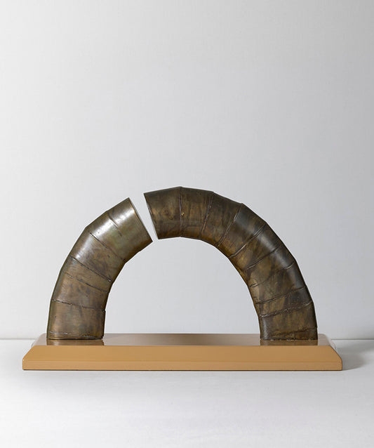 Asymetrical | Abstract bronze arch on solid marble base.