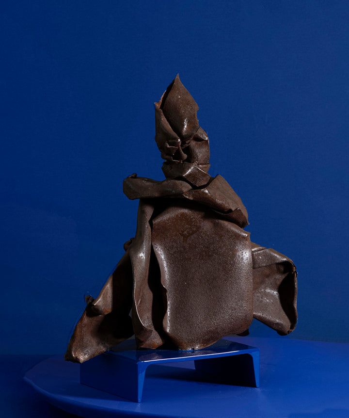 Manipulated Postmodern metal sculpture. This one-of-a-kind figure has an almost fabric-like quality, as each bend and crease in the metal give it a unique brutalist personality.