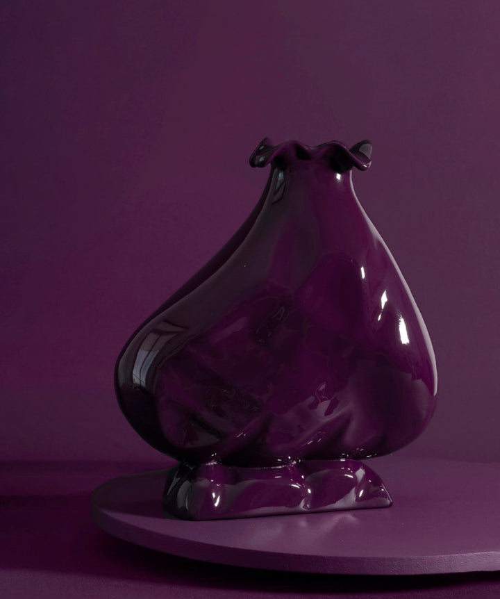 Hand sculpted wood vessel with a voluptuous lower body that narrows as it reaches her feminine neck. 