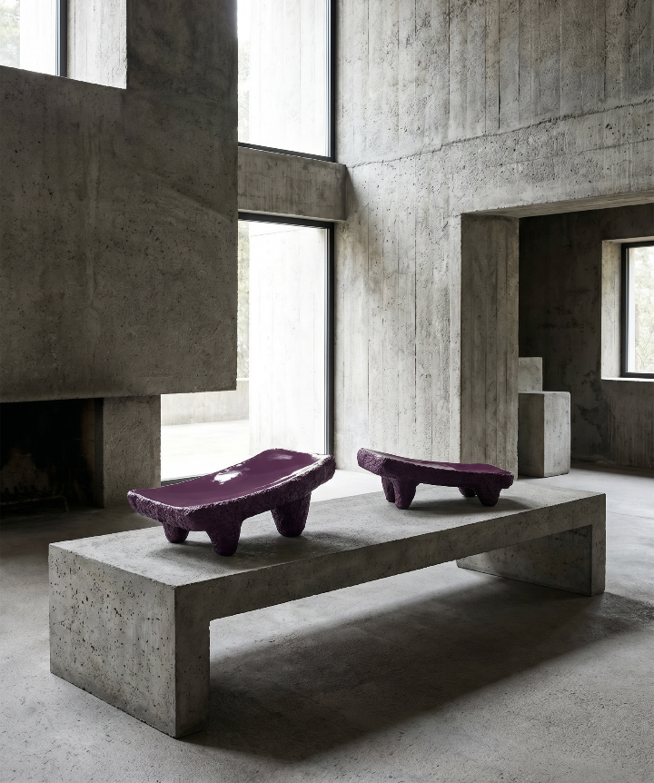 Pair of large Metate slabs made from Basalt volcanic rock. Tops have been smoothed to read like glass and sit on top of its textured base, creating a deliberate contrast. 